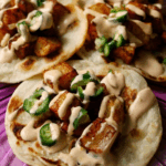 spicy potato tacos on a plate
