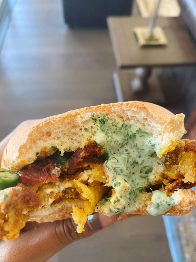 a burger with a bite taken out of it