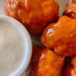 Wings on a plate with ranch.