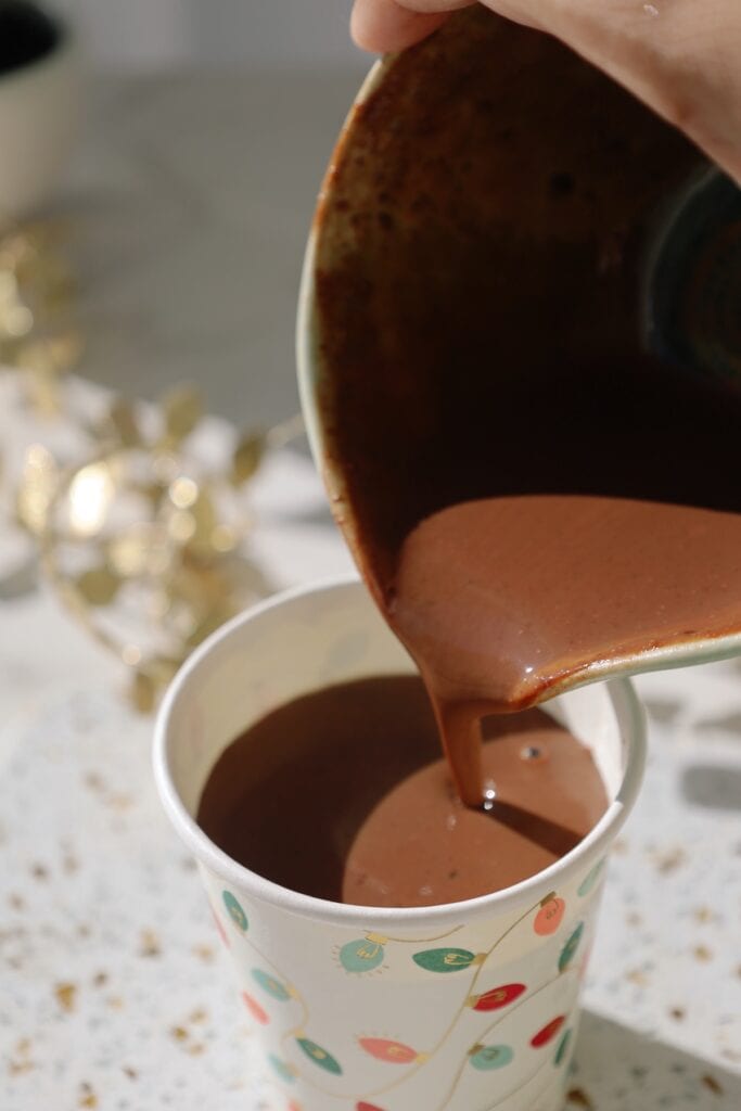 pouring homemade hot chocoalte