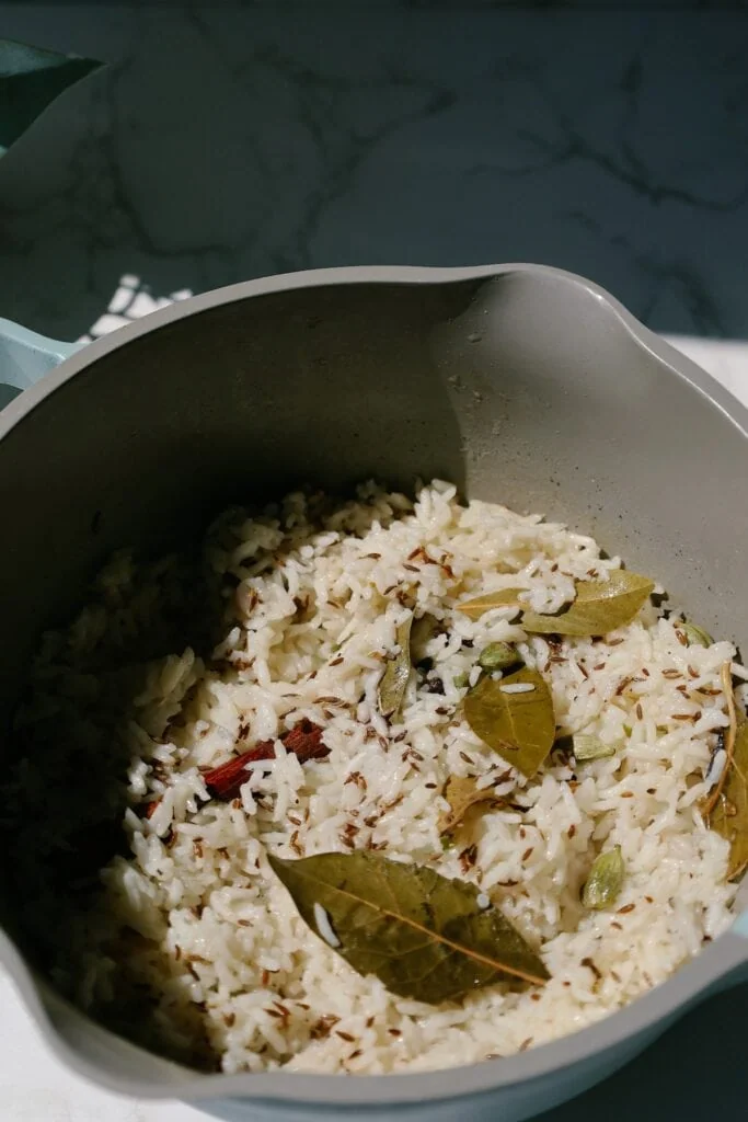 close up of rice with bay leaves