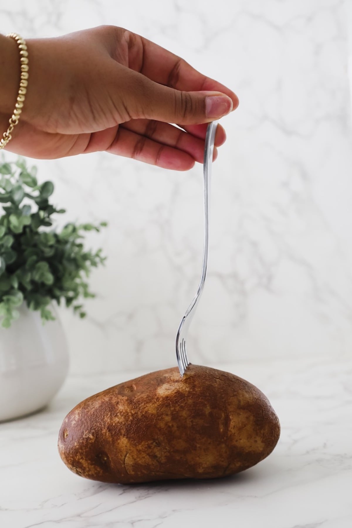 cooking a russet potato for the cheesy korean potato pancake