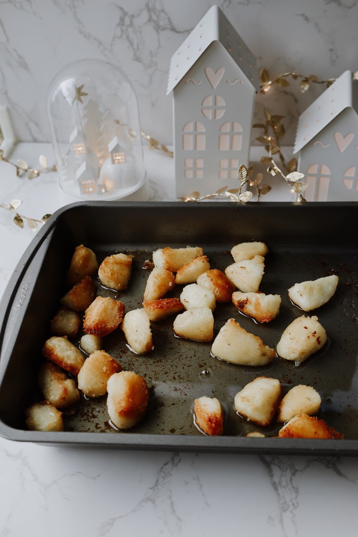 crispy oven roasted potatoes in a baking sheet