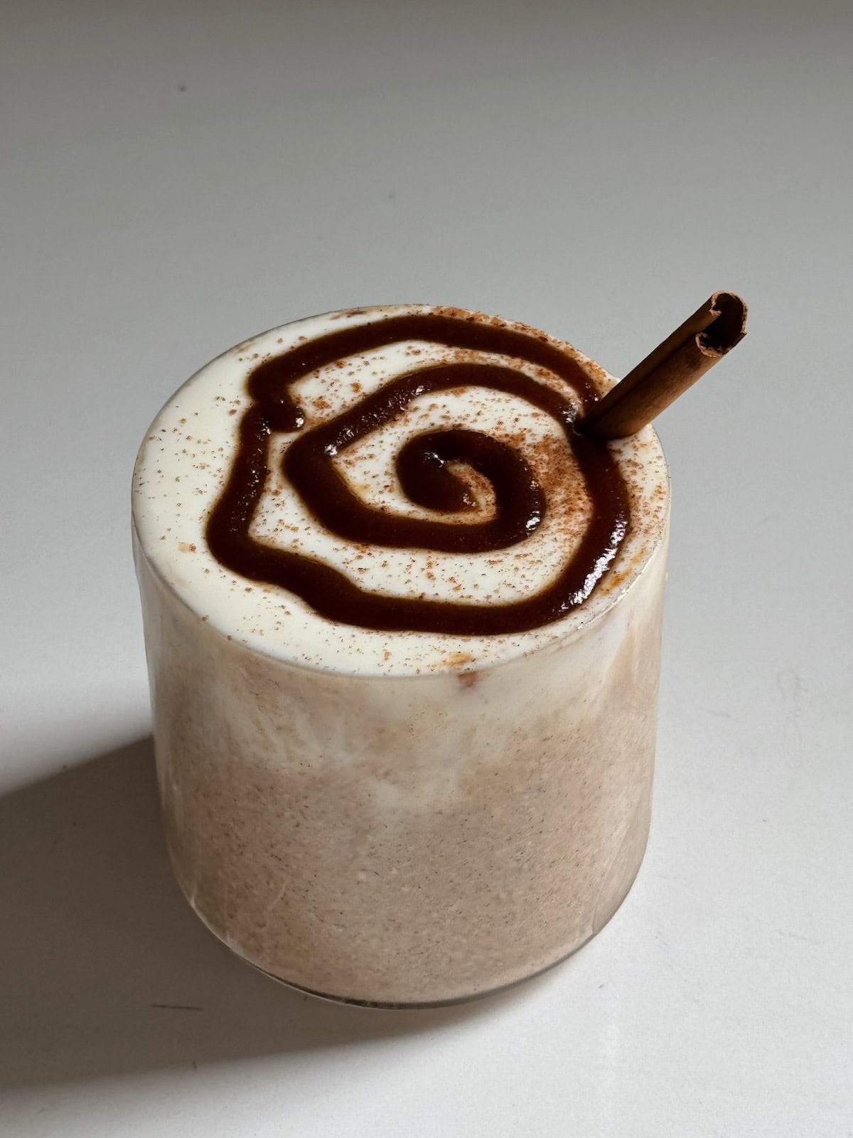 Final recipe in a cup with a cinnamon stick.