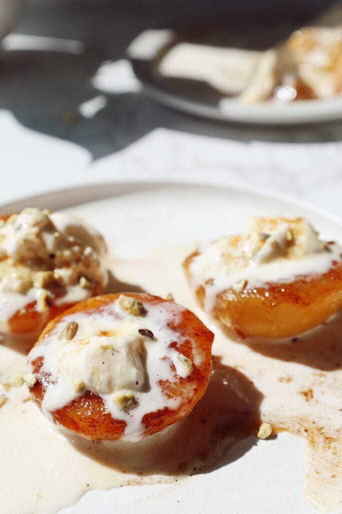 3 peach halves with ice cream and caramel