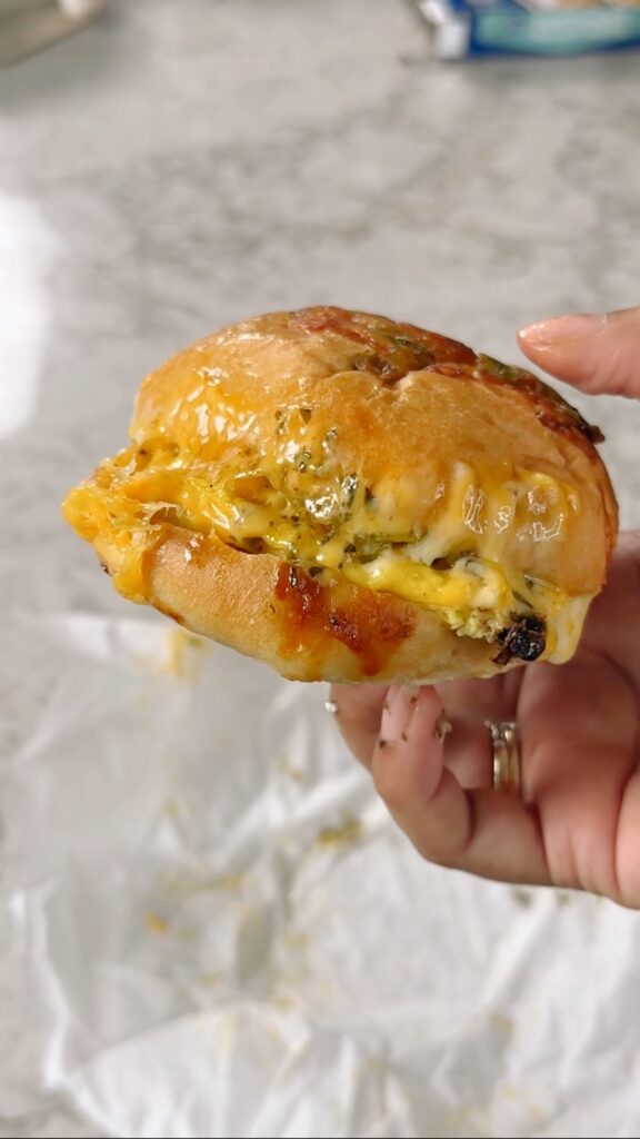 hand holding sandwich