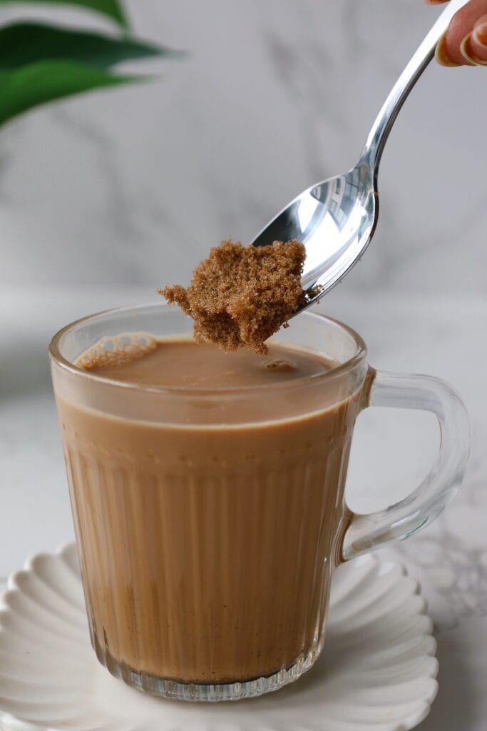 Step six: sweeten the masala chai with sugar or jaggery.
