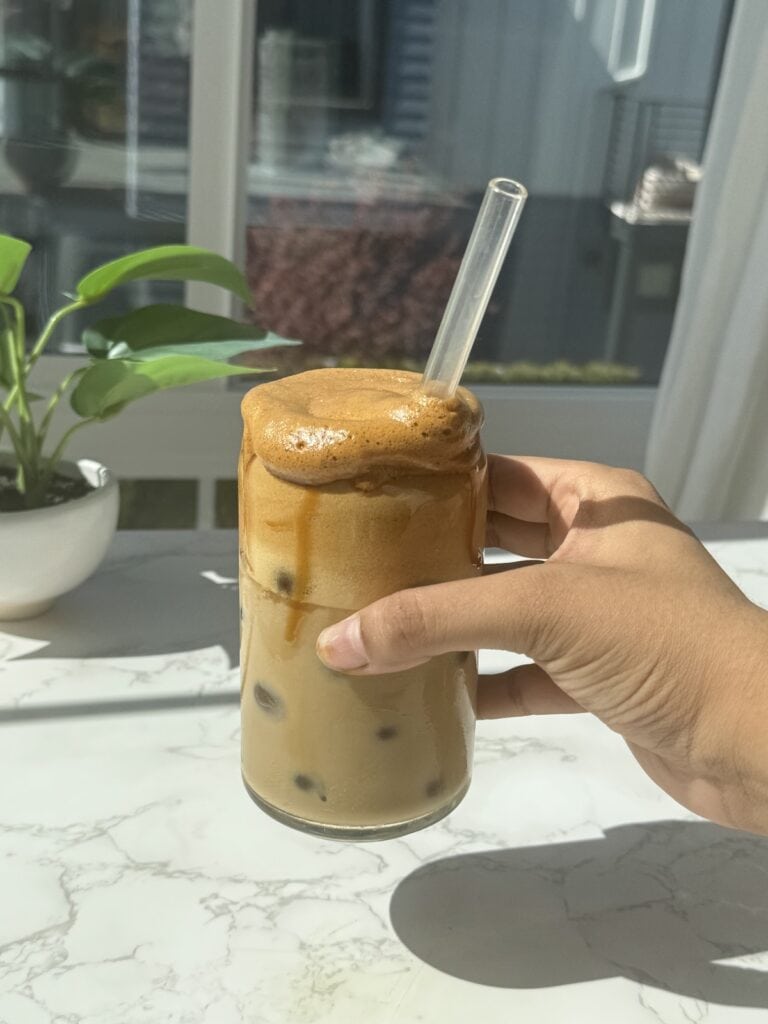 whipped honey coffee with a straw