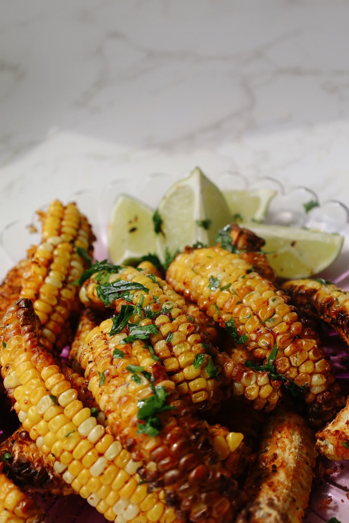 Corn ribs recipe on a plate with parsley.