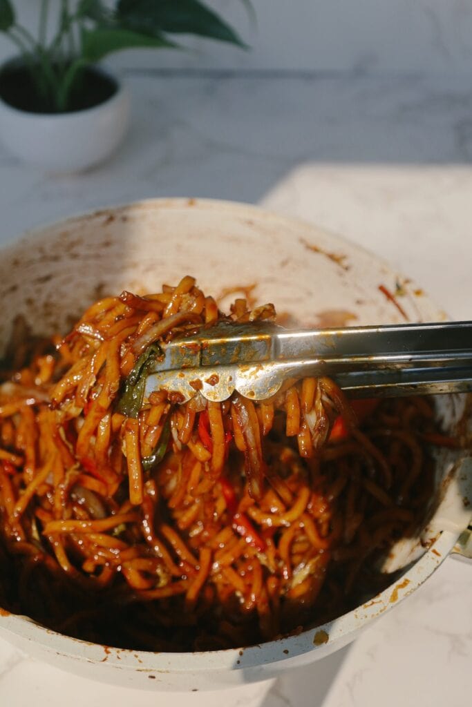 noodles with tongs