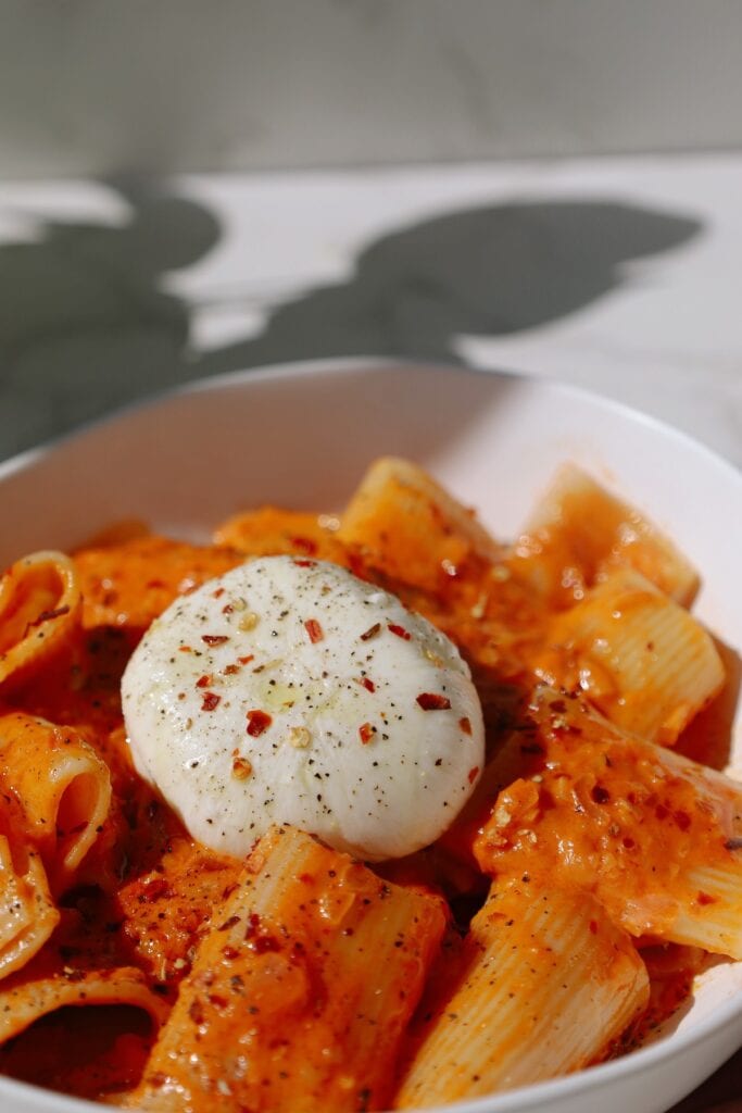 pasta on a plate with burrata