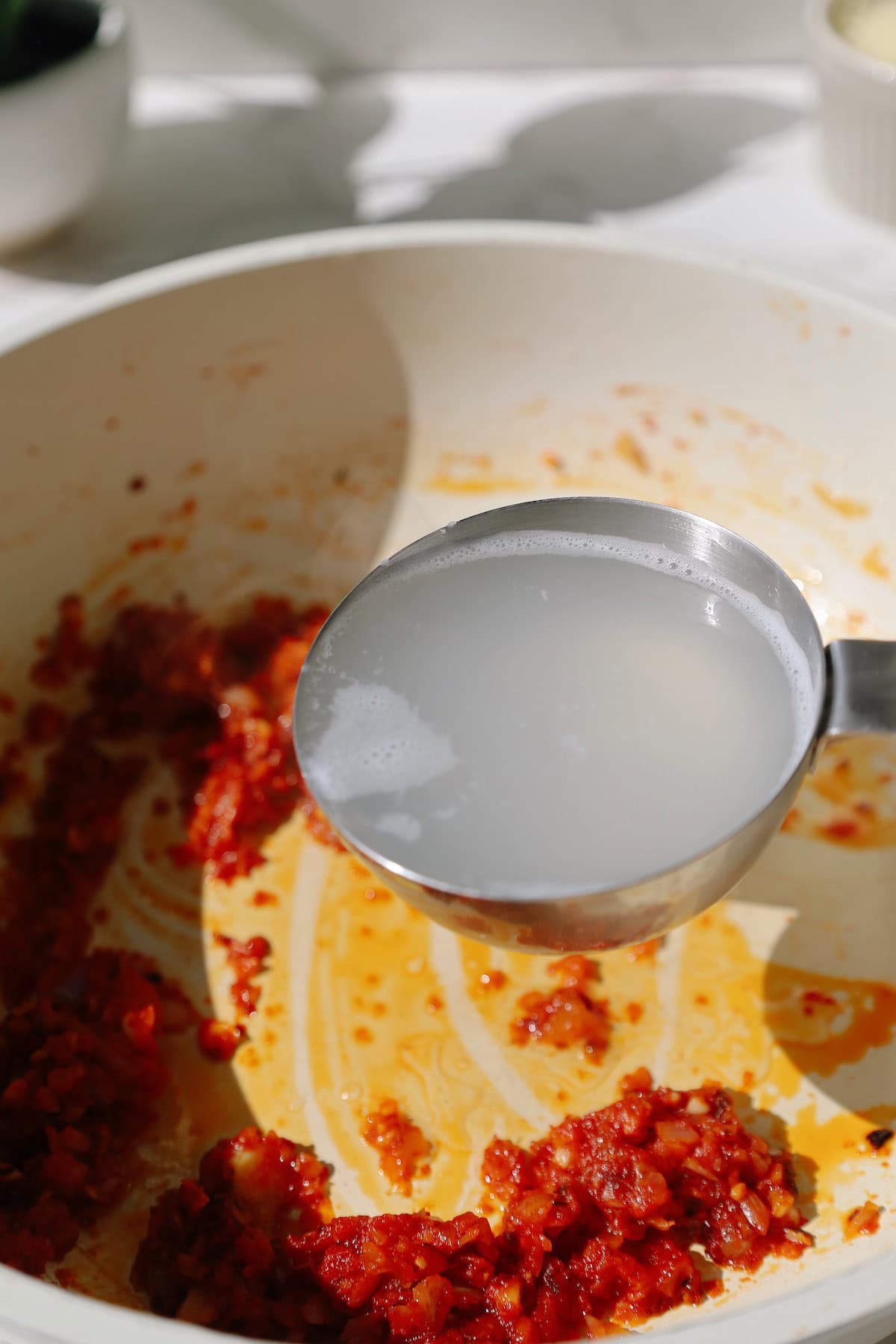 Step three: add pasta water.