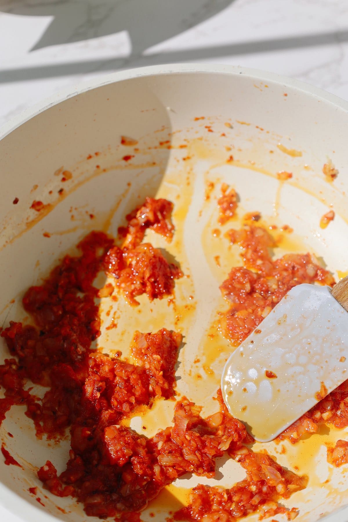 Step two: add tomato paste.