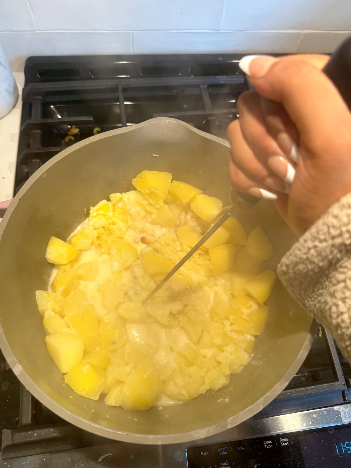 Garlic mashed potato recipe step four: mash the potatoes.