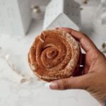 Tiramisu cookie with frosting and cocoa powder.