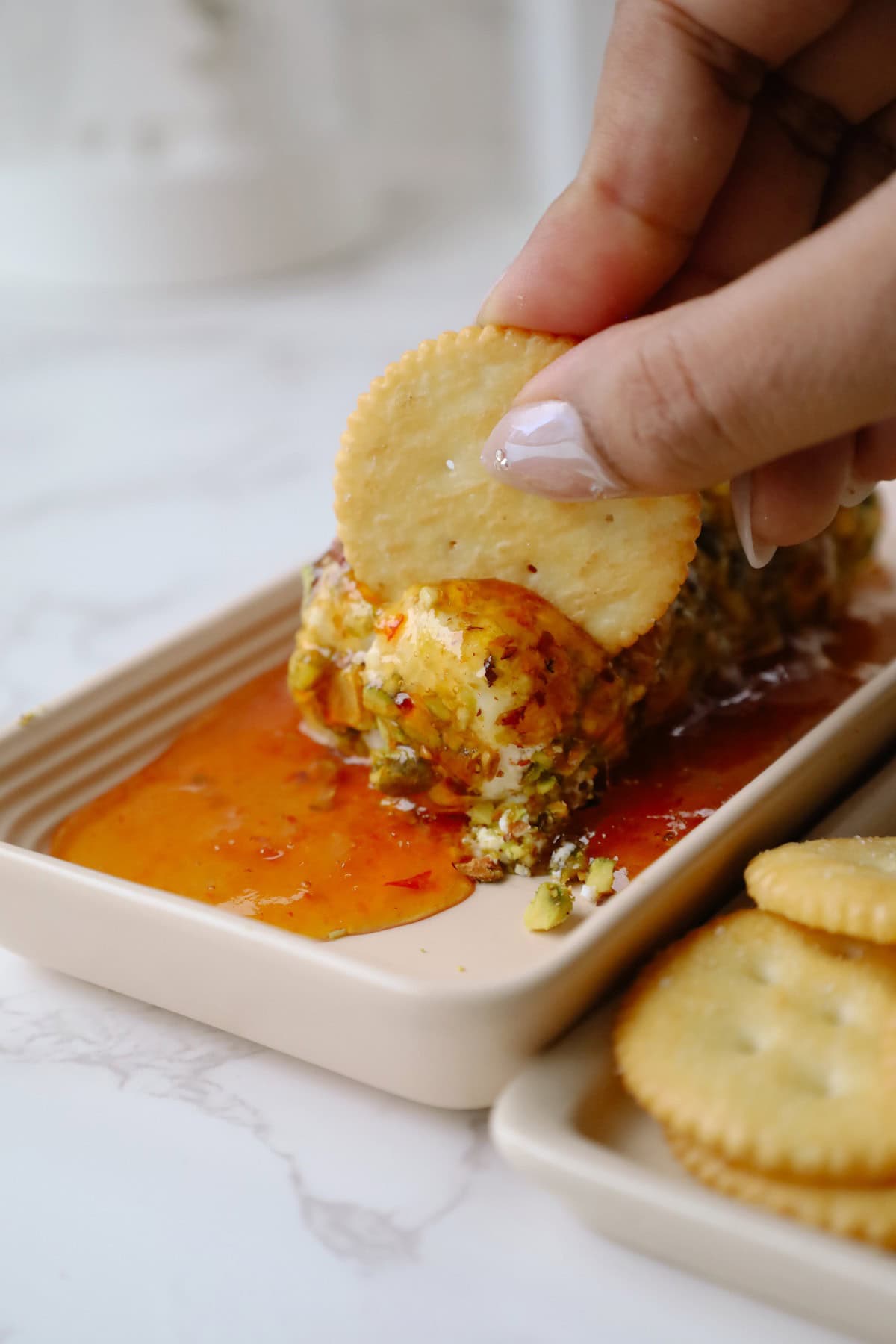 Goat cheese appetizer served with crackers.