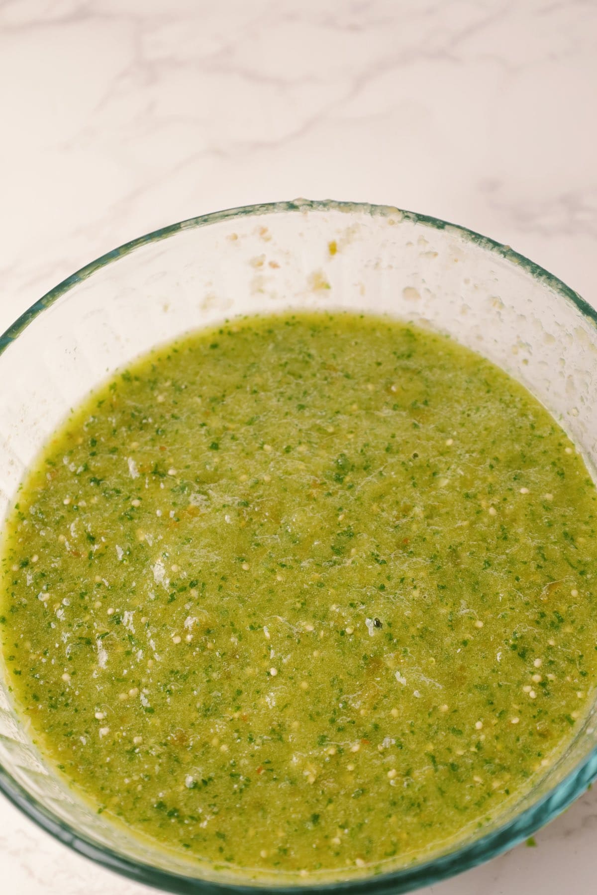 A bowl filled with salsa verde.
