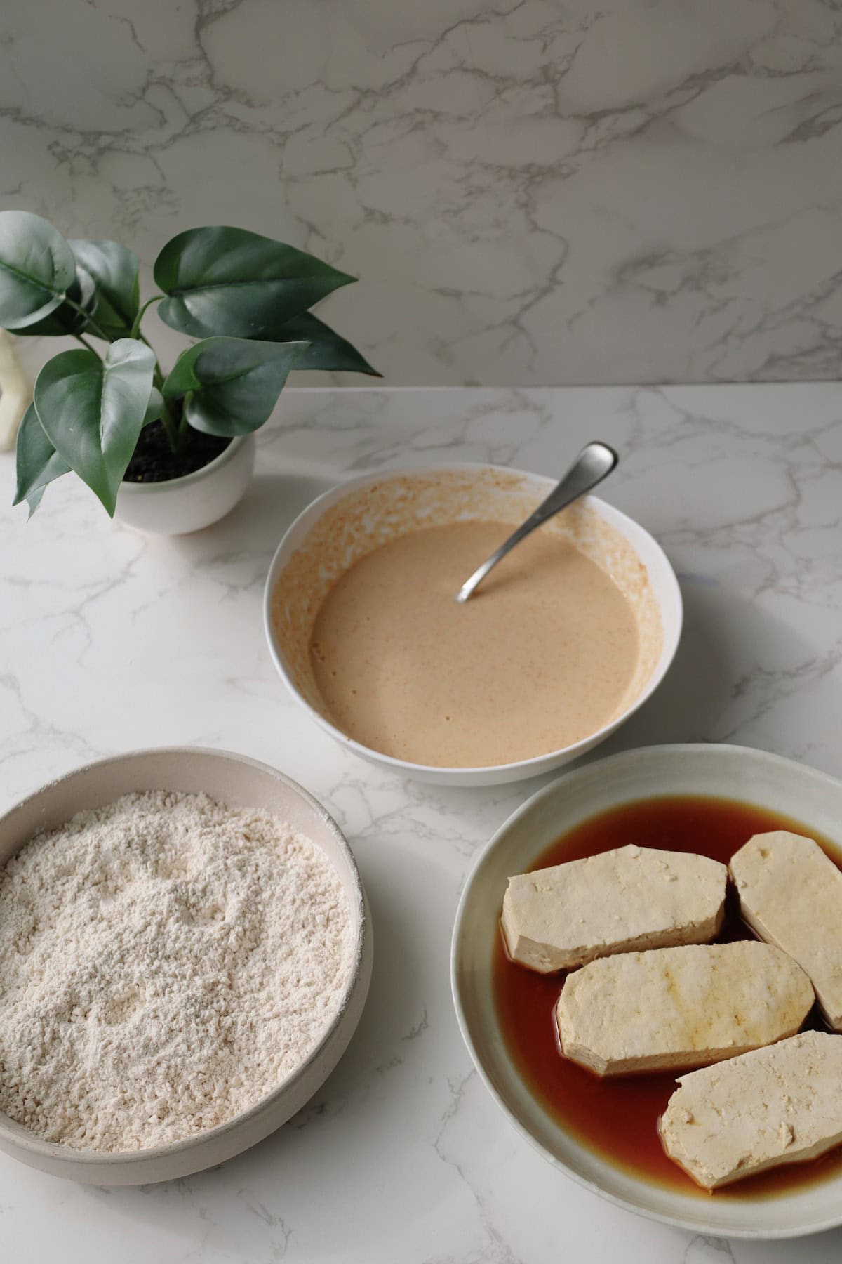 battering station with tofu, wet batter, and dry batter.