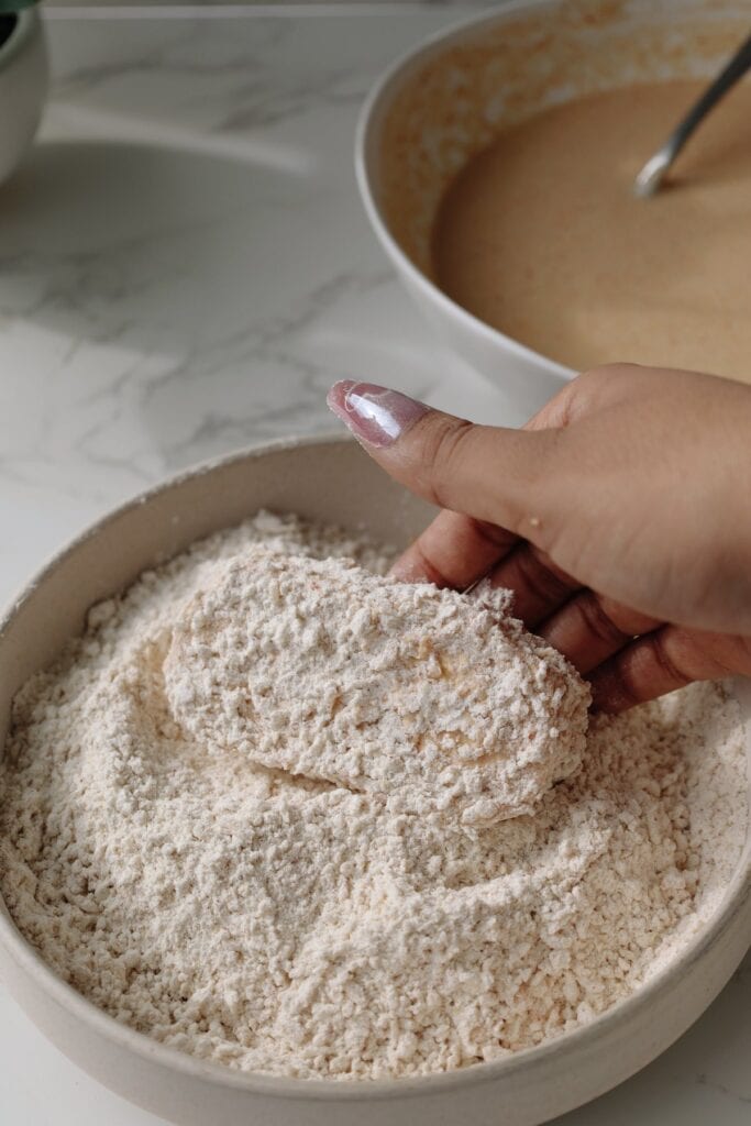 step three: coat the tofu in the dry batter.