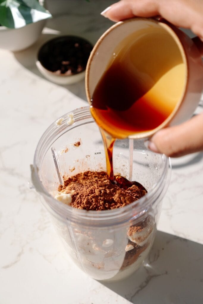 chocolate tofu pudding step two - pouring all of the ingredients into the blender
