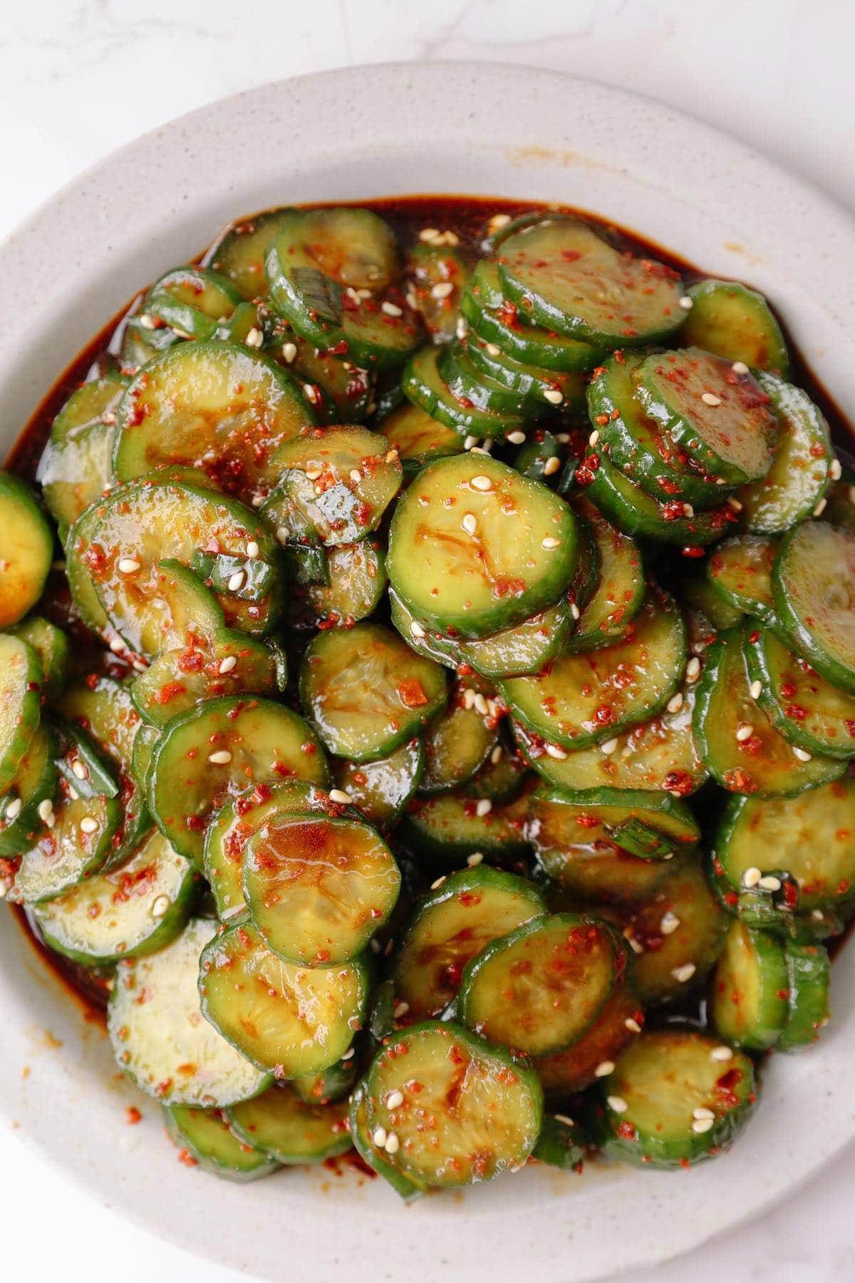 Step four: garnish and serve the Korean cucumber salad.