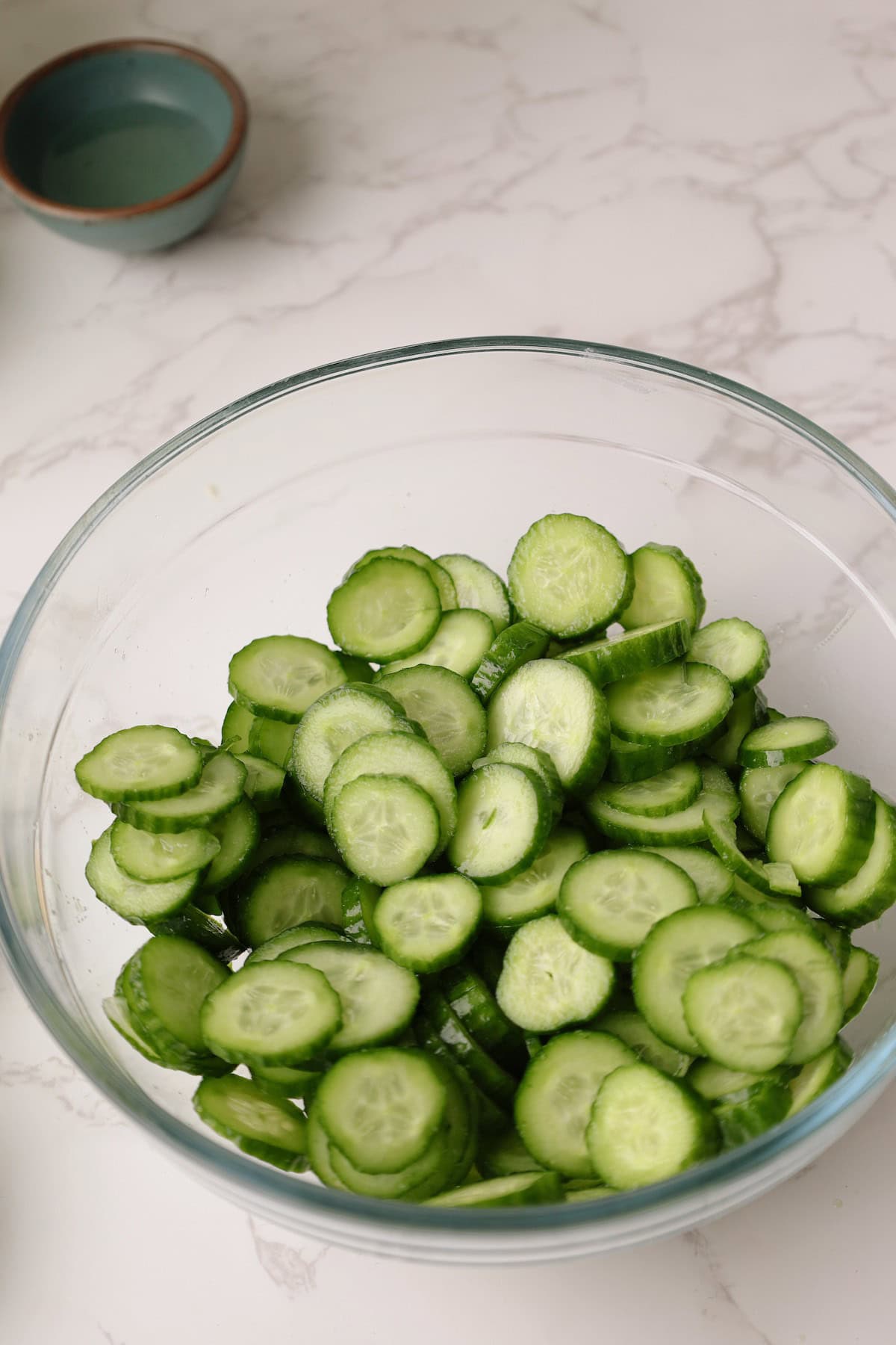 Step one: cucumbers in a bowl with salt.