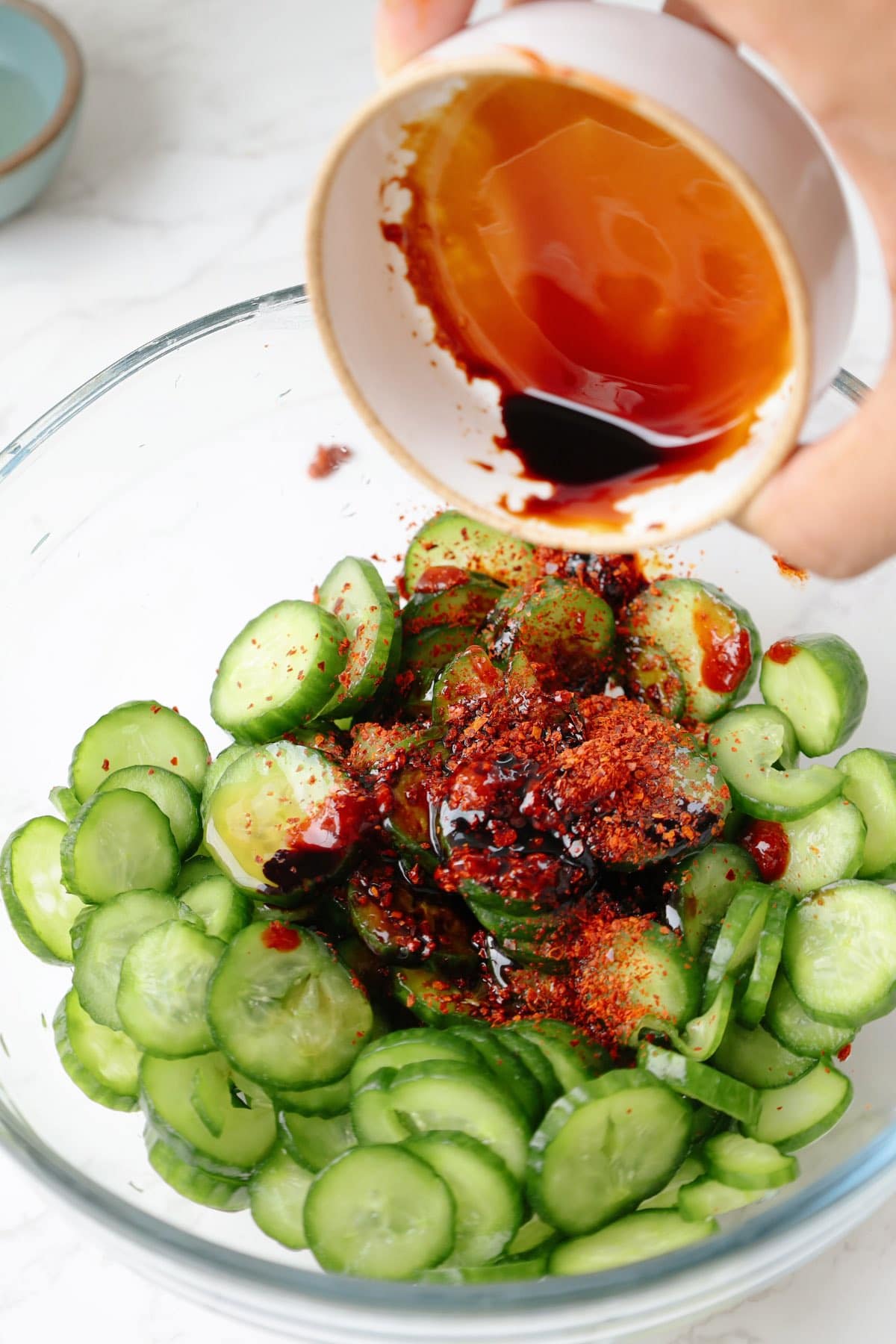 Step two: add the sauces to the cucumbers.