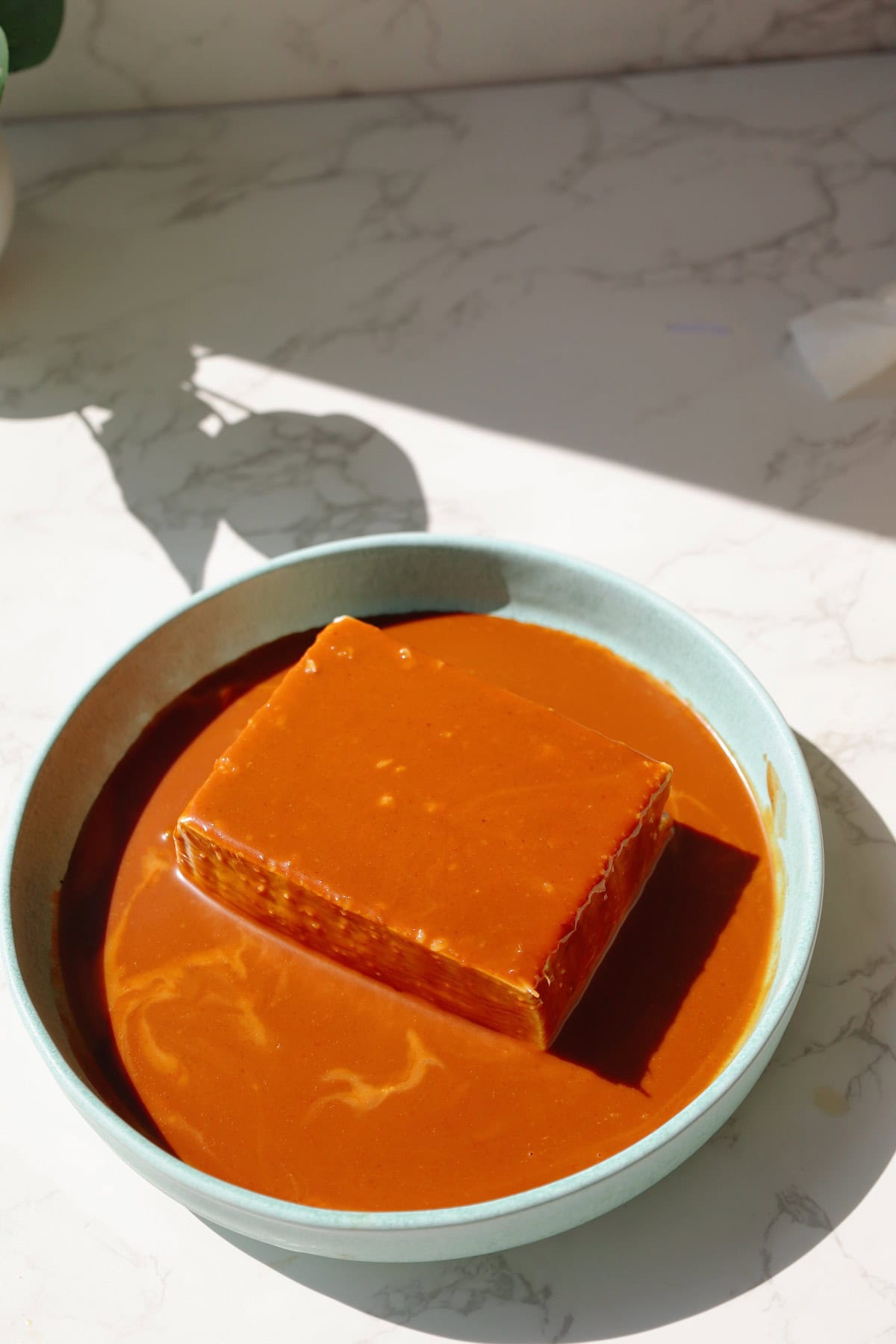 Step four: spoon the sauce over the tofu.