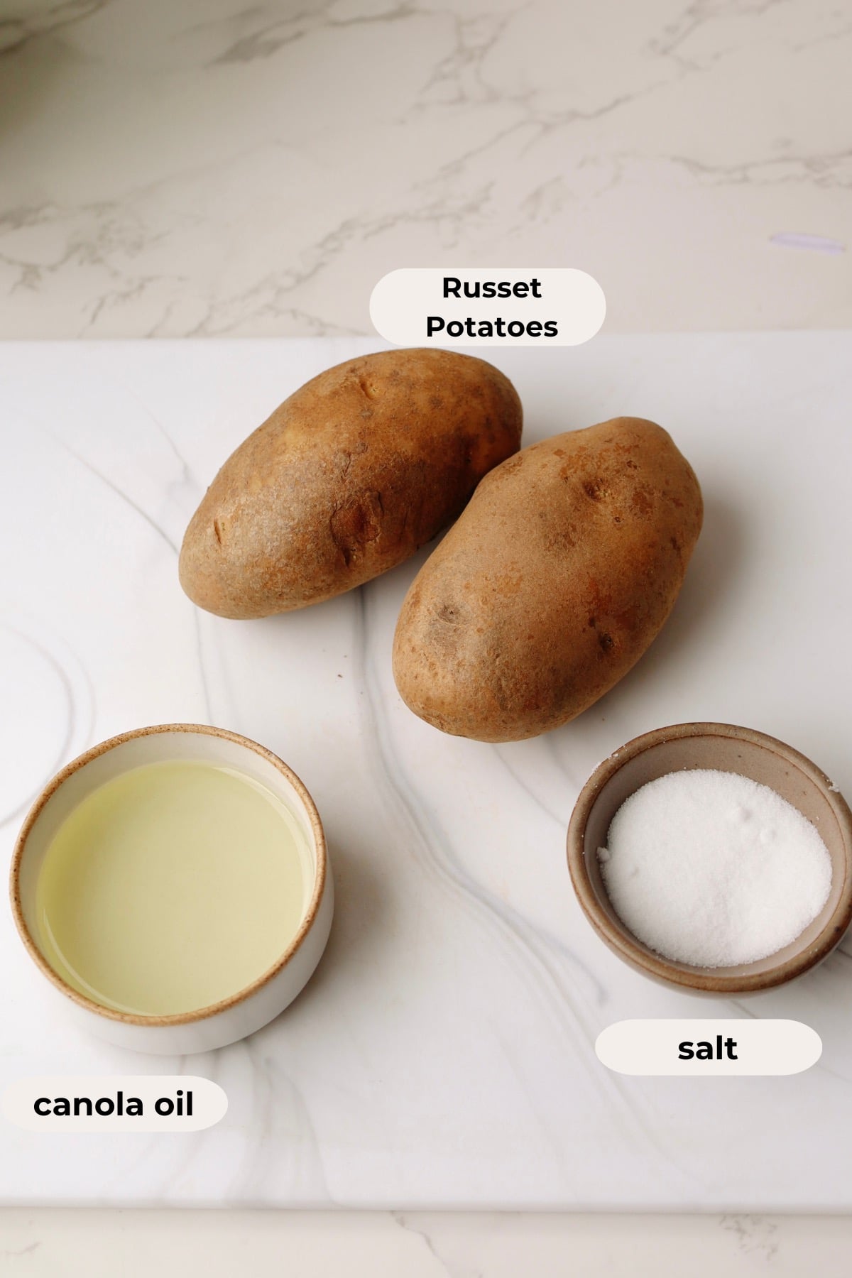 Ingredients for the recipe: russet potatoes, canola oil, and salt.