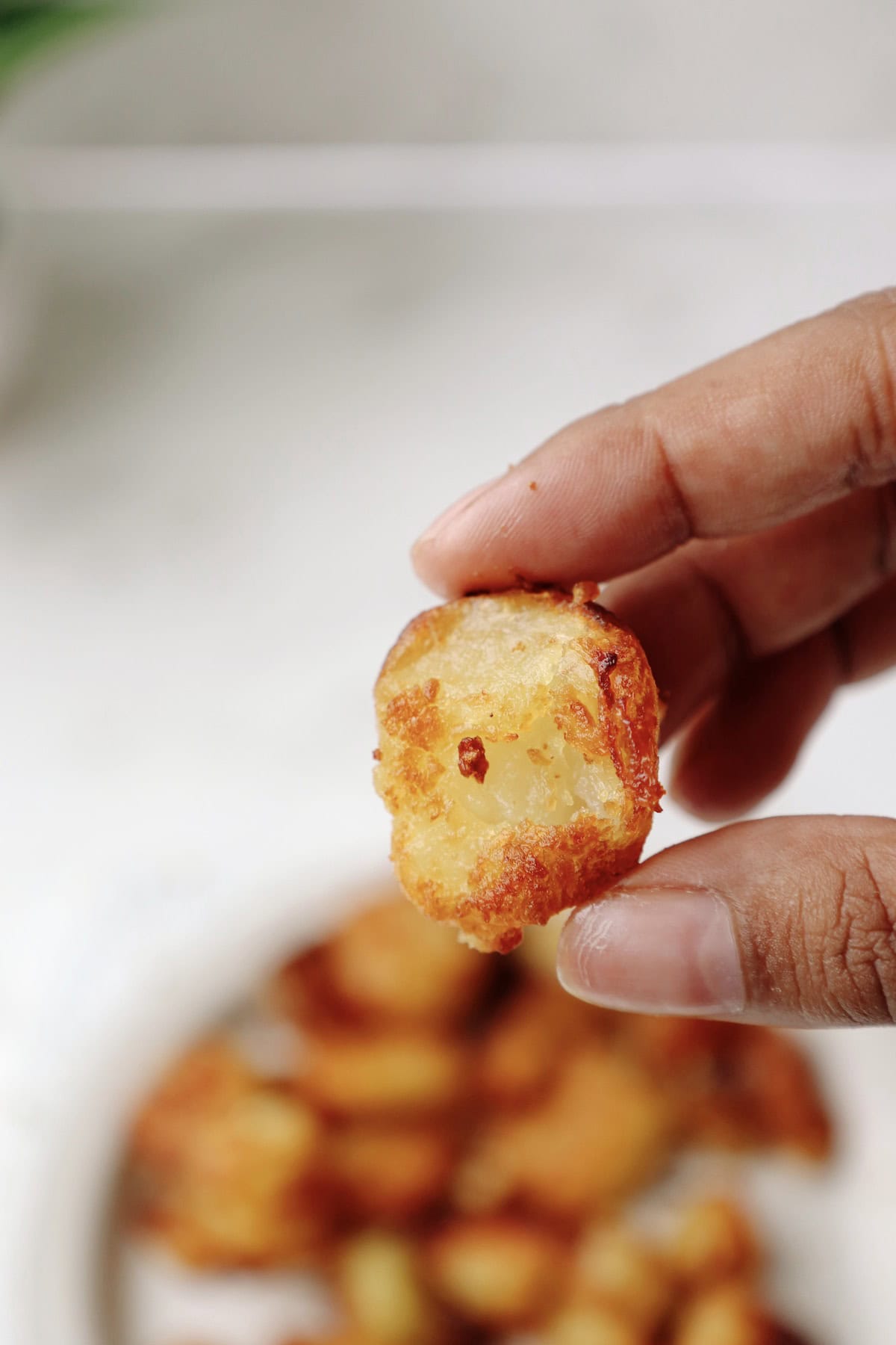 Step Five: Air fry the potatoes until they are golden brown and crispy.