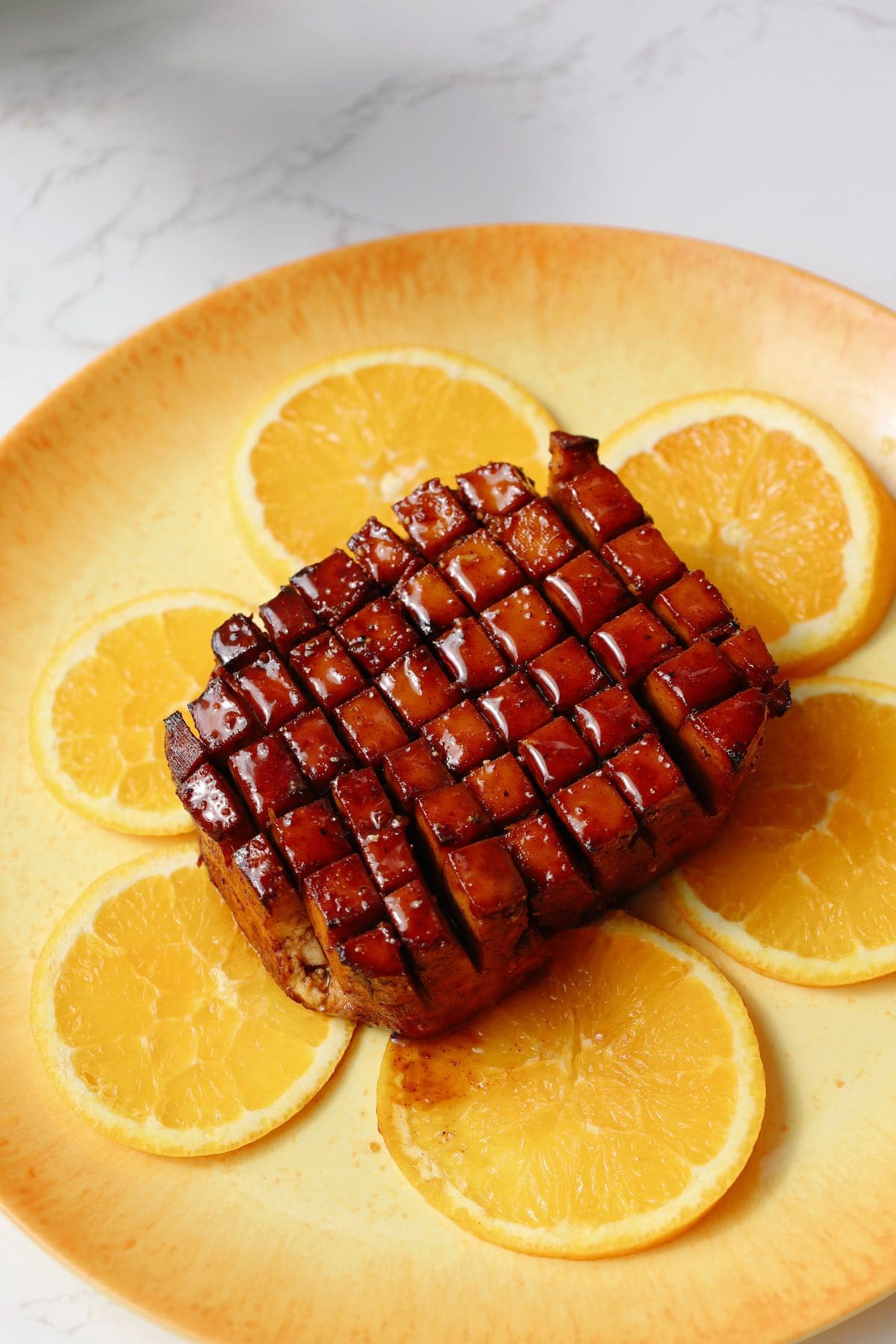 Another photo of the final recipe with a glaze on top on a plate.