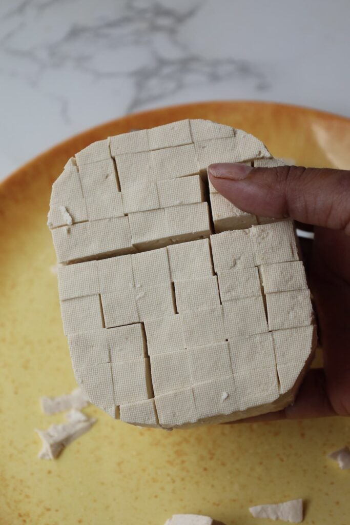 Score the tofu in a cross hatch pattern.