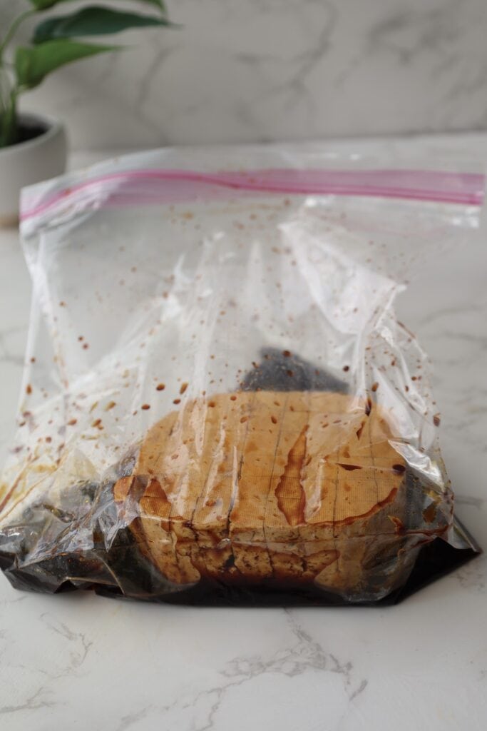 Marinate the tofu in a ziplock bag.