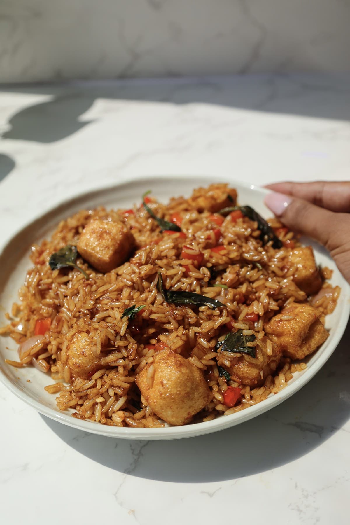 Thai basil fried rice on a large plate.