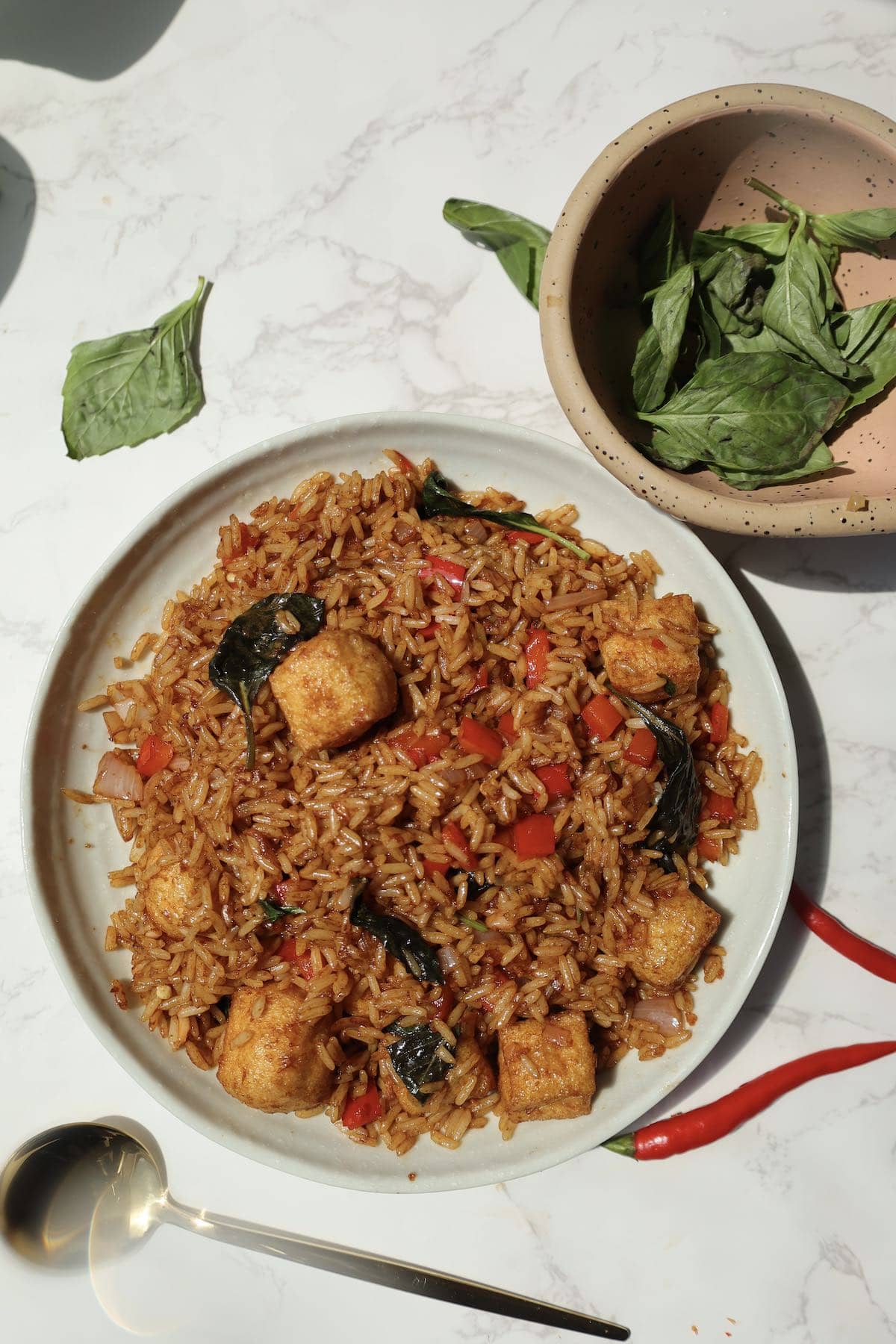 Thai basil fried rice with thai chilies on the side.