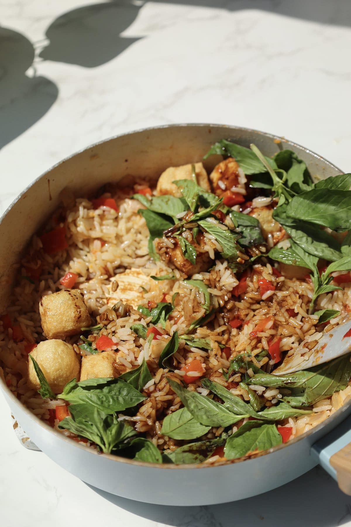 Step five: add basil and sauce.