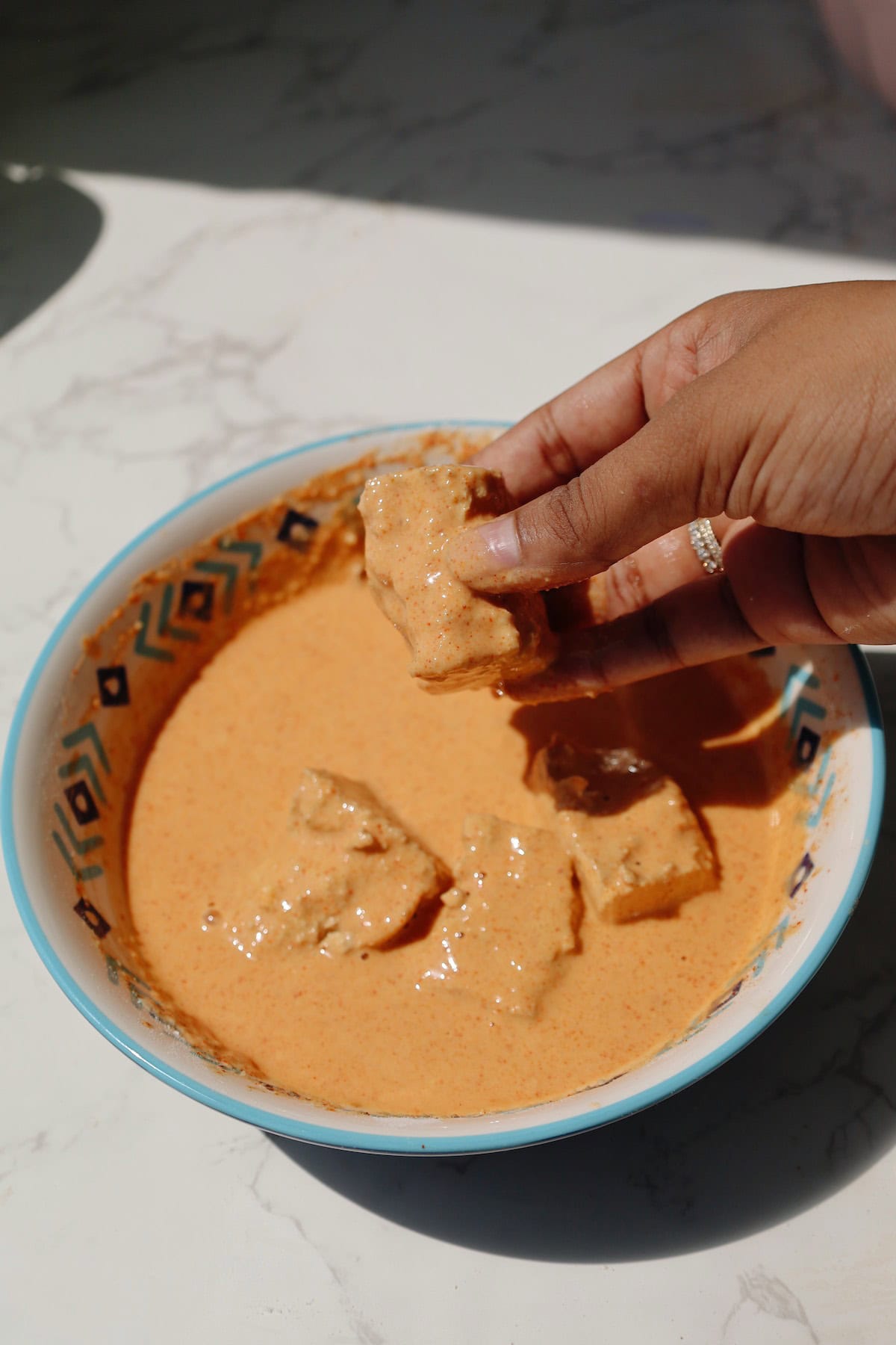 Vegan chicken nuggets step four: coat in wet batter.