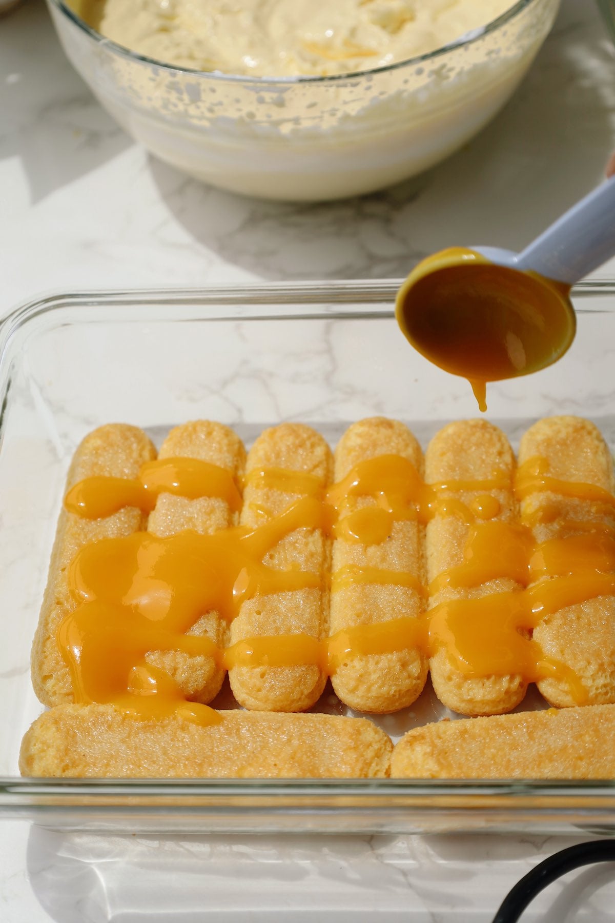 Step three: soak the lady fingers.