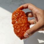 Vegan chicken tender with lemon pepper sauce.