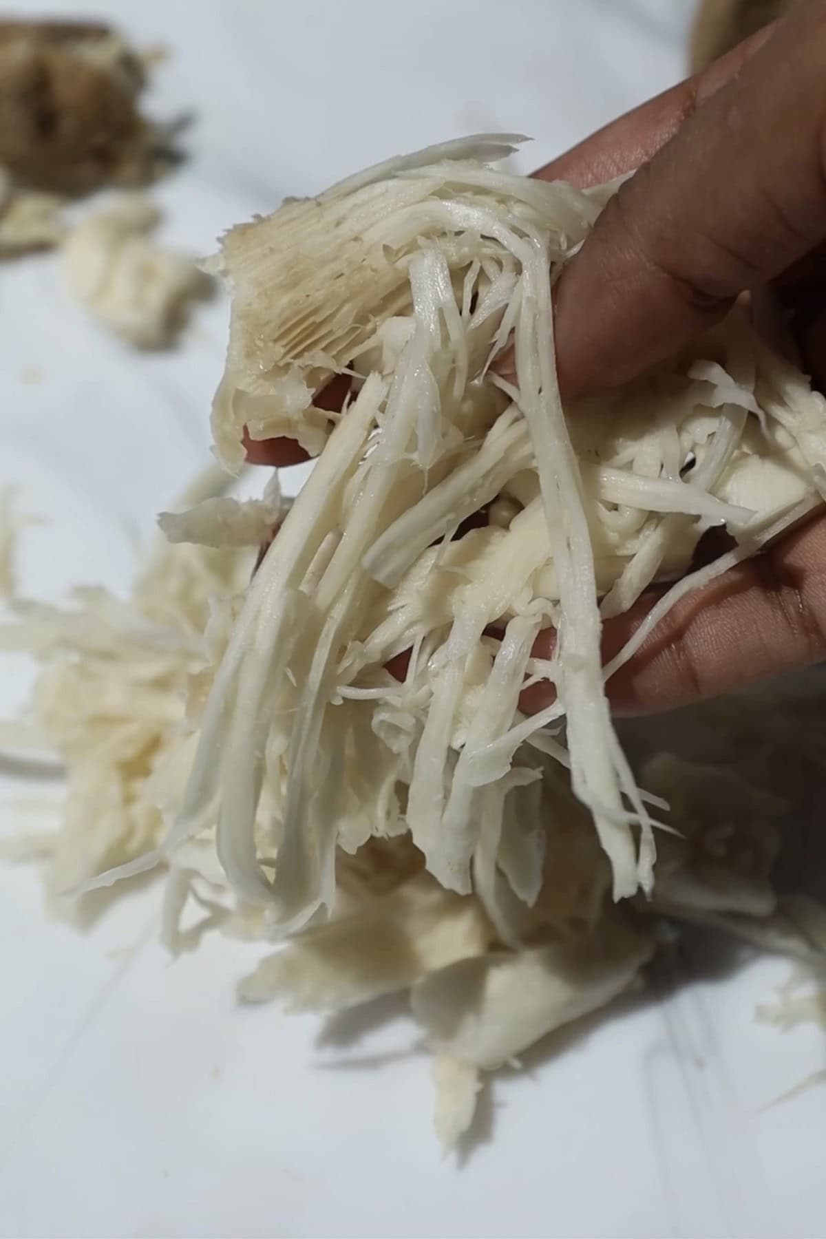 Step one: shred the mushrooms.