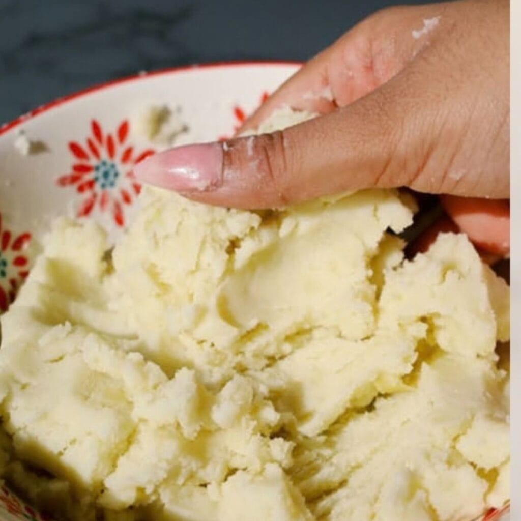 a mixture of boiled potatoes, salt and tapioca starch being mashed in a bowl.