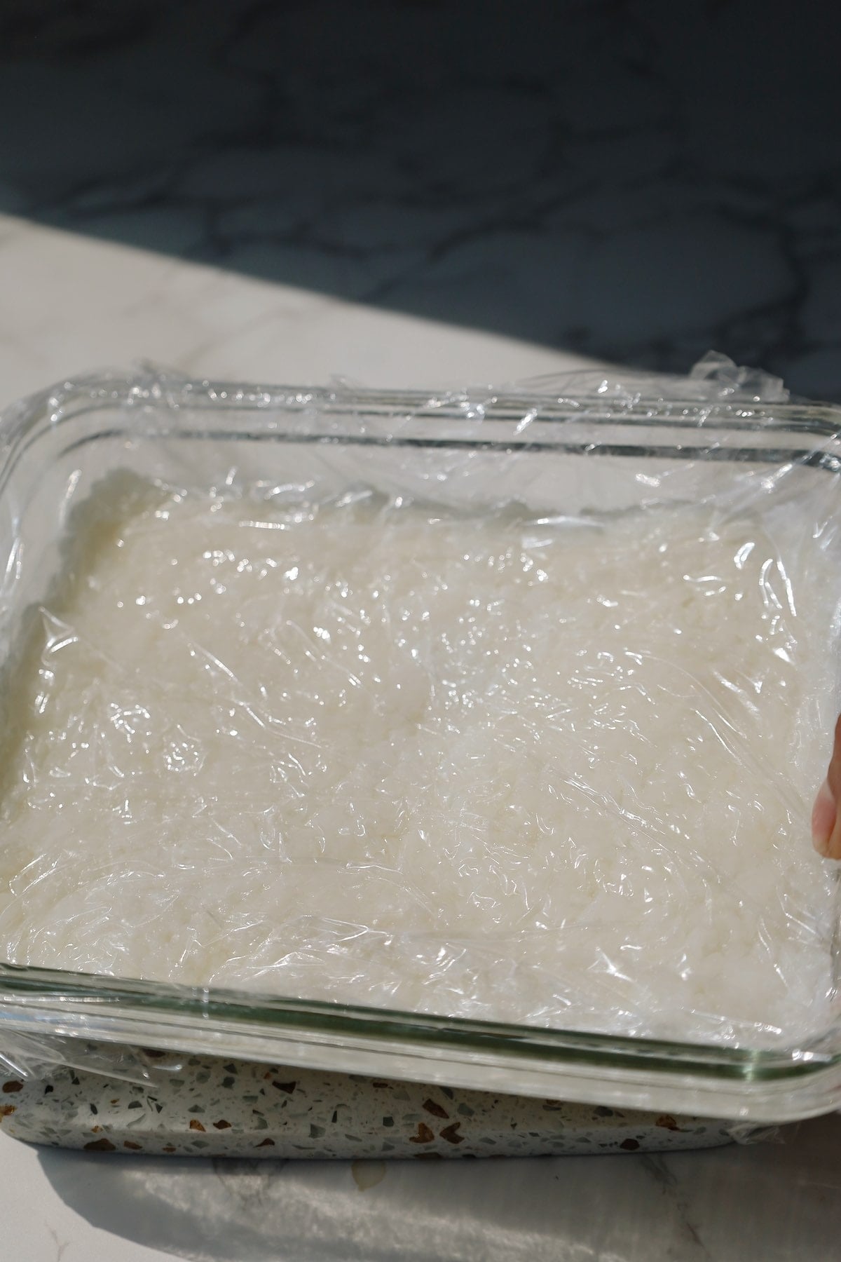 Step 3: add cling film and press again.
