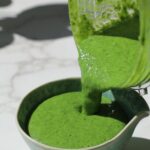 Blending fresh herbs and yogurt into a smooth, creamy Indian mint chutney.