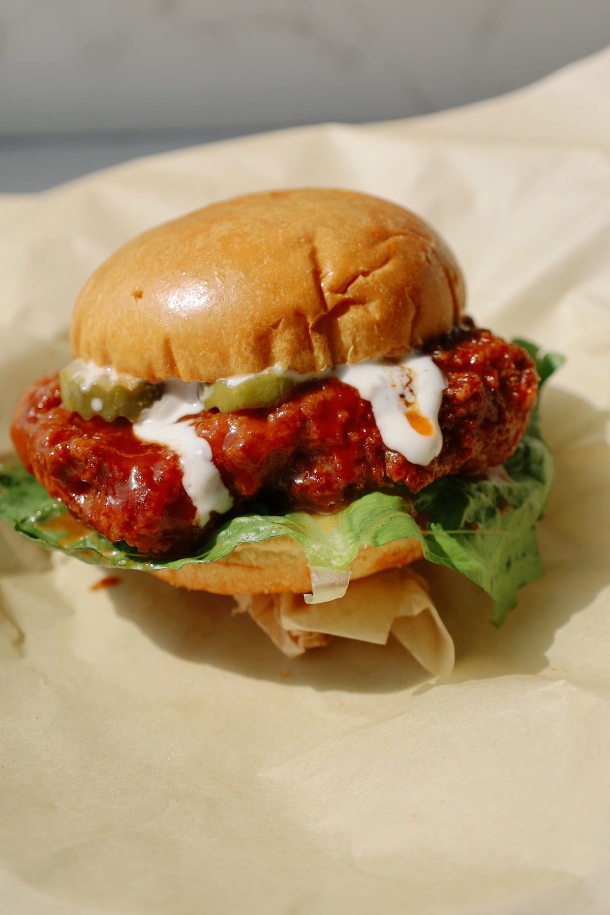 Oyster mushroom burger on parchment paper.